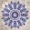 Stylish textured old paper background with kaleidoscope snowflake