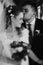 stylish wedding couple hugging and posing. luxury bride and groom embracing. tender sensual moment. romantic black white photo