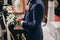 Stylish wedding couple standing in church for holy matrimony. Beautiful bride and groom praying at wooden altar in church, wedding