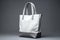Stylish white canvas tote highlighted on a sleek gray surface