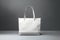 Stylish white canvas tote highlighted on a sleek gray surface