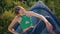 Stylish woman posing field in evening sunlight closeup. Calm girl resting boat