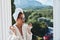 stylish woman wearing sunglasses posing in a bathrobe on a balcony rest Mountain View