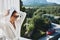 stylish woman wearing sunglasses posing in a bathrobe on a balcony rest Mountain View