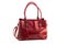 Stylish women\\\'s bag on a white background. Fashionable accessory made of burgundy leather