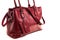 Stylish women\\\'s bag on white background. Fashionable accessory made of burgundy leather