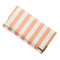 Stylish women`s purse pink striped isolated on the white background. Closeup of modern pink leather wallet over white