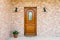 Stylish wooden front - entrance door in a detached house - embed