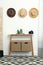 Stylish wooden table with boxes at white wall