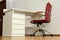 Stylish workplace interior with office chair and desk