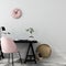 Stylish workplace with a pink chair