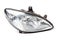 Stylish xenon headlight of a German car - optical equipment with a lamp inside on a white isolated background. Spare part for auto