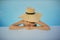 Stylish young woman in hat relaxing in blue pool and enjoying summer holiday. Summer tropical vacation. Girl in sunhat on vacation