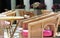 Stylishly decorated table in the restaurant with pink cushions on the chairs against t