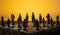 Stylized chess pieces on a board with orange background and selective focus