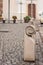 Stylized concrete bollards on cobble stone pavement