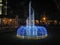 A Stylized, Decorative LED Fountain Decorates a Lawn in A Residential Area at Night