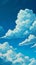 Stylized illustration of cumulus clouds in a blue sky