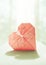 Stylized image of a paper origami heart with backlight