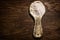 Stylized, old clay rural spoon. Ceramic spoon with flour on a wooden table.