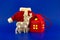 Stylized reindeer, gift box and Santa Claus suit