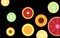 Stylized sliced fruit slices isolate on black background vector.