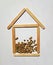 Stylized wooden house silhouette is full of lentil seeds