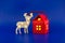Stylized wooden reindeer and house shaped gift box