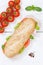 Sub sandwich whole grain grains baguette with ham portrait format from above on wooden board