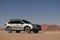 Subaru Outback standing in the middle of the Namib desert.