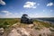 Subich, Khmelnytskyi, Ukraine - May 14, 2023: Suzuki Jimny JB43 with Niken roof rack box, 4x4 SUV. View point on a top rocky