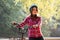 Subject ecological mode of transport bicycle. Beautiful young kasazy woman wearing a blue helmet and long hair poses standing next