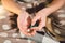 Subject medicine health and pharmaceuticals. Close-up macro young caucasian woman hands pulling out a green blister. Packing two