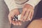 Subject medicine health and pharmaceuticals. Close-up macro young caucasian woman hands pulling out a green blister. Packing two