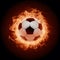 Subject Soccer ball surrounded by fiery flames in dramatic illumination