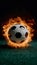 Subject Soccer ball surrounded by fiery flames in dramatic illumination