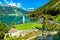 Submerged Bell Tower of Curon and a cemetery on Lake Reschen in South Tyrol, Italy