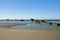 The submerged elements of the artificial port of Gold beach in Asnelles in Europe, France, Normandy, Arromanches les Bains, in