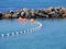 Submerged shark net against a breakwall