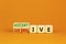 Submissive or assertive symbol. Concept words Submissive and assertive on wooden cubes. Beautiful orange background. Business,