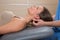 Suboccipital massage therapy to woman with doctor hands