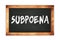 SUBPOENA text written on wooden frame school blackboard