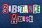 SUBSTANCE ABUSE text word collage, colorful fabric on blue denim, addiction and abuse concept