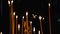 Subtle church candles burn in an Orthodox Christian