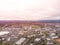 Suburb, city at sunset. Houses and streets from above. Background