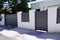 Suburb home grey brown dark metal aluminum gate slats portal access house door