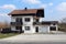 Suburban family house with old style wooden fence balcony