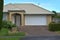 suburban garage with white roller door