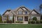 Suburban home exterior with a stone porch in a neighborhood in North Carolina