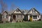 Suburban home with a stone and brick exterior in a neighborhood in North Carolina